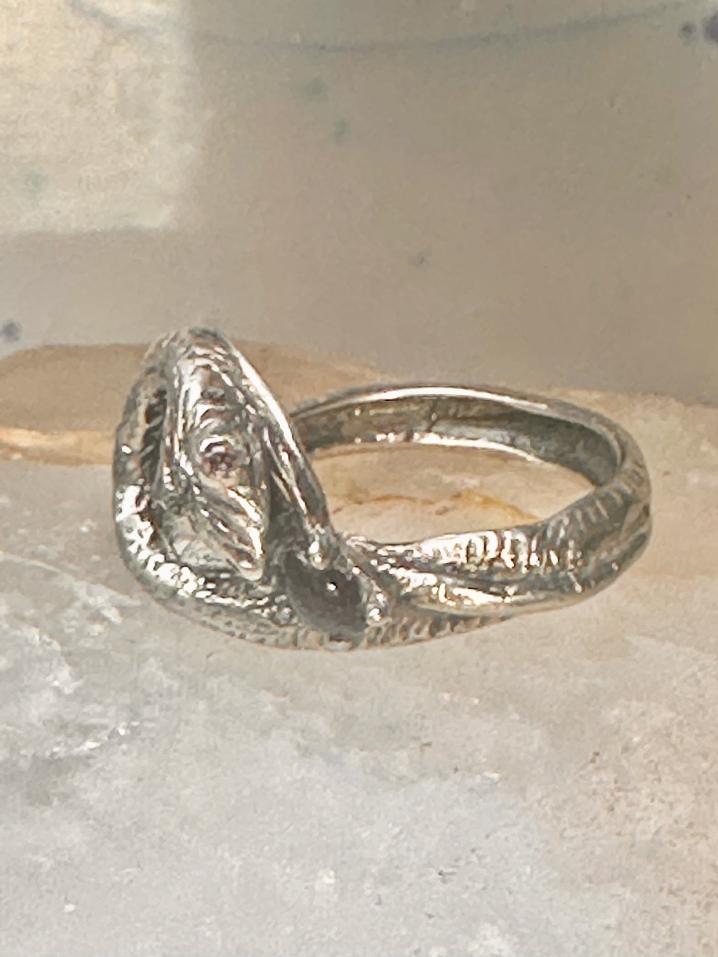 Snake ring size 6.50 holding a stone probably onyx purple stone eyes sterling silver women