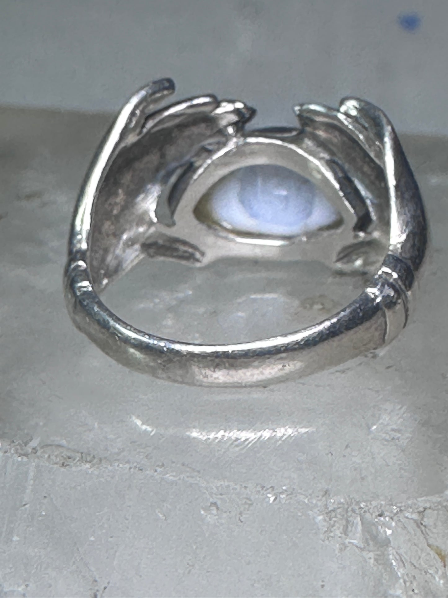 Hands holding an Eye ring pinky band size 5.50 sterling silver women