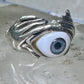 Hands holding an Eye ring pinky band size 5.50 sterling silver women