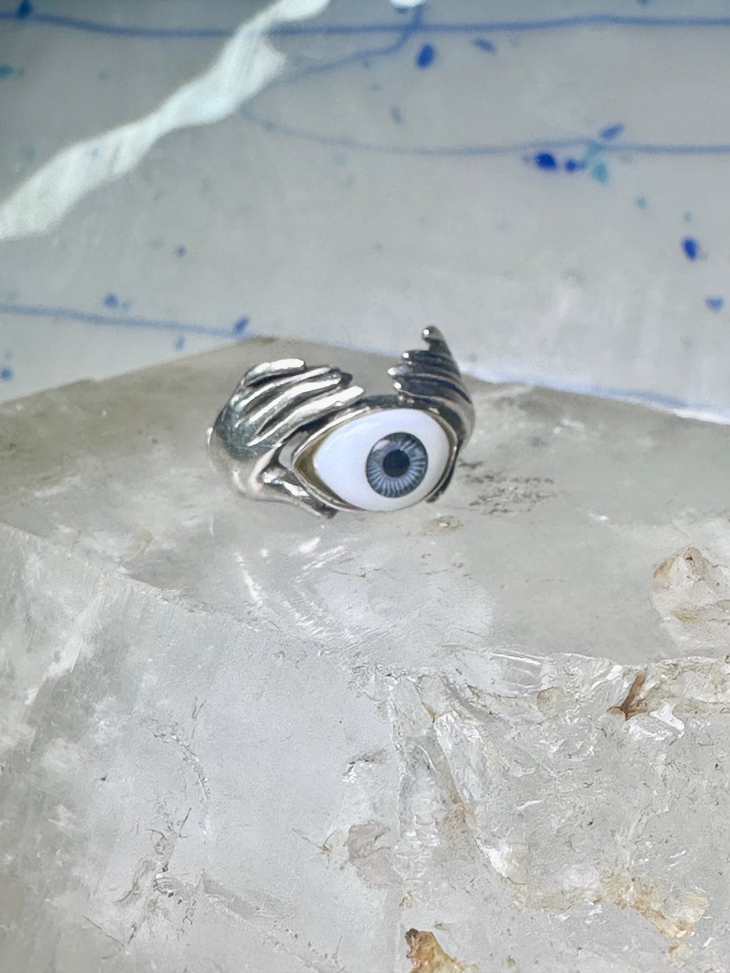Hands holding an Eye ring pinky band size 5.50 sterling silver women