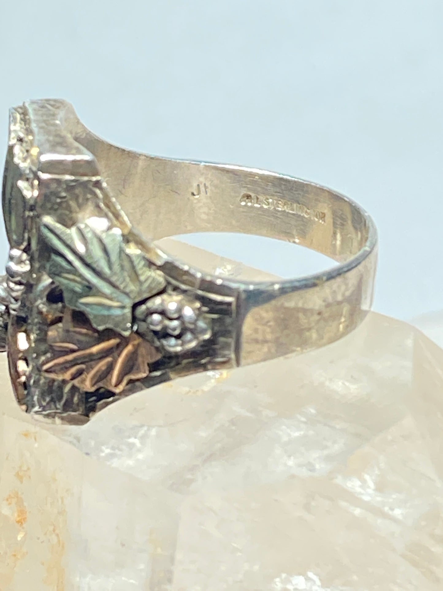Leaves detailed with overlay metals over sterling silver men