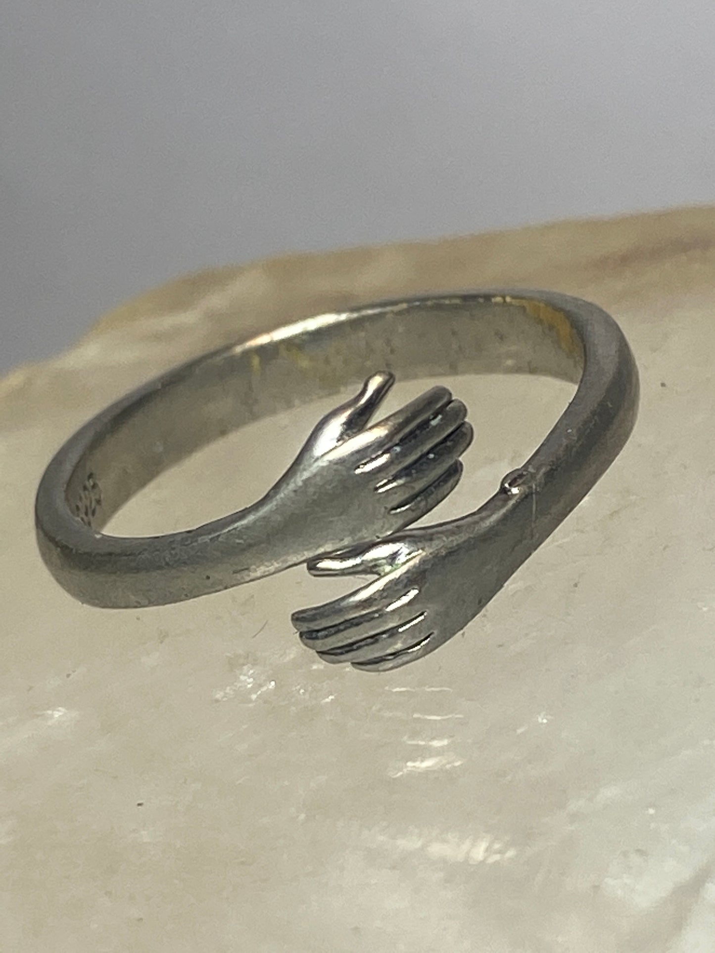 Hands ring bypass band  size 7 adjustable  sterling silver women