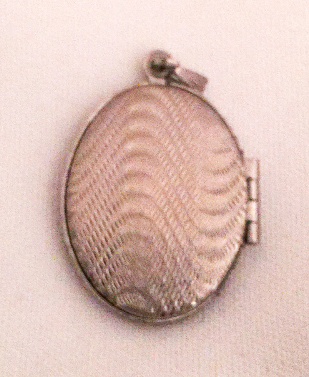 Locket with Oval Decorative Design and Oval Shape