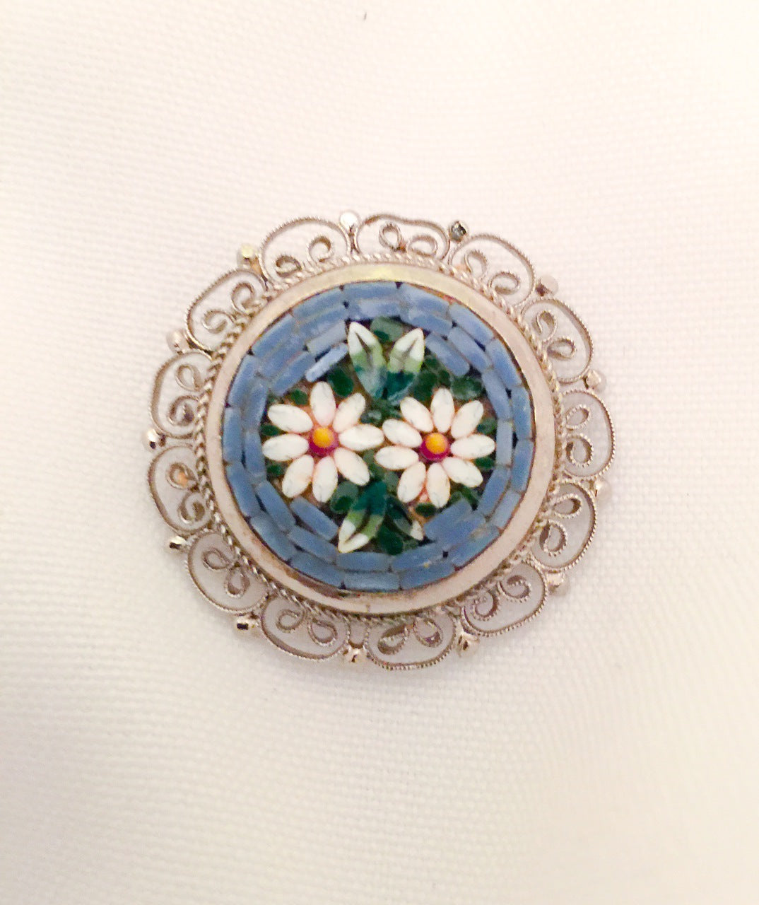 Vintage Venetian Circular Micro-Mosaic Pin with Flowers in a Light Blue Background
